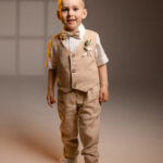 boys’ linen ring bearer suit set including tailored pants, vest, suspenders, and a bow tie