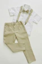 Beige boys linen pants with suspenders and matching bow tie styled with white short sleeve shirt