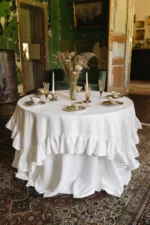 Close-up of natural linen fabric and drape of a round wedding tablecloth