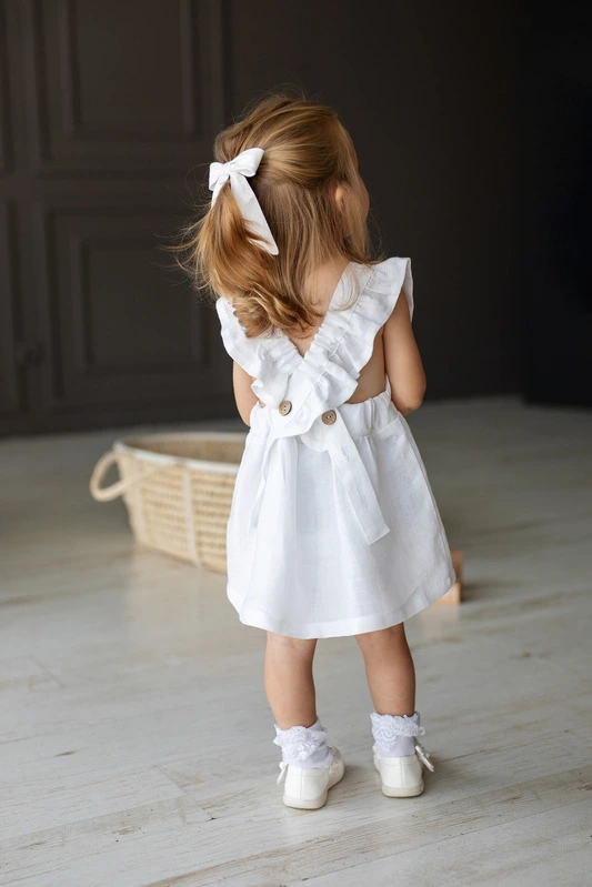 linen pinafore dress with open cross back design